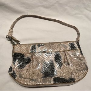 Small tan and black snake skin-like material purse